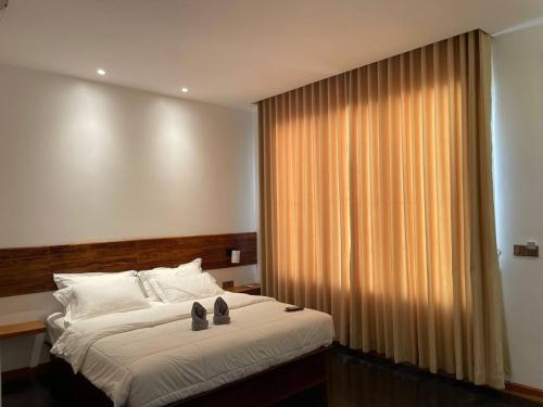 Postel nebo postele na pokoji v ubytování UMA Residence