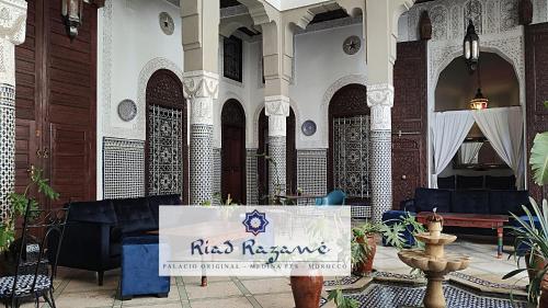 a building with a sign that reads rise insurance at Riad Razane Fez in Fès