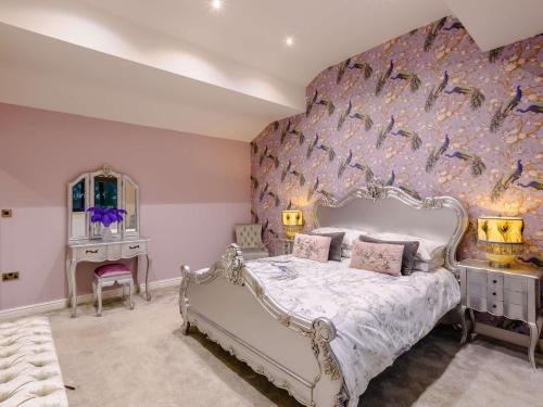 a bedroom with a white bed and a purple wall at 2 Bed in Pendle 91032 in Brierfield