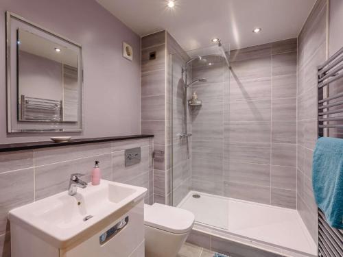 a bathroom with a sink and a toilet and a shower at 2 Bed in Pendle 91032 in Brierfield