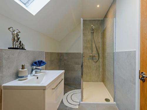 a bathroom with a shower and a sink at 3 Bed in Lulworth Cove 91200 in West Lulworth