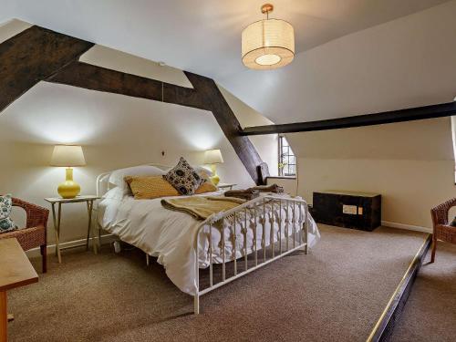 a bedroom with a large bed in a attic at 2 Bed in Llanover 91242 in Abergavenny