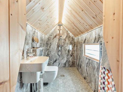 a bathroom with a sink and a toilet at 1 Bed in Biggar 91249 in Libberton