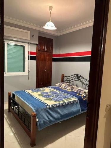 Tempat tidur dalam kamar di Holikeys - El Jadida - 2 Ch - Sidi Bouzid 003