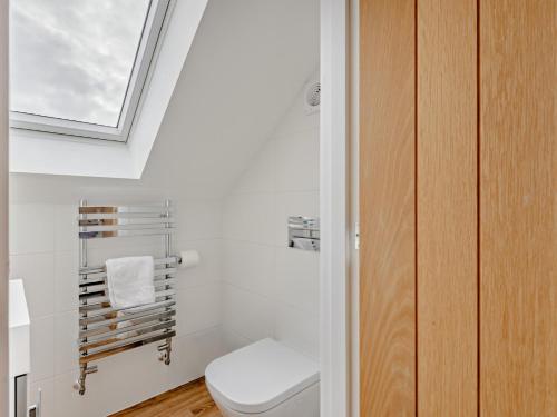 a bathroom with a toilet and a window at 3 Bed in Whitstable 91063 in Whitstable