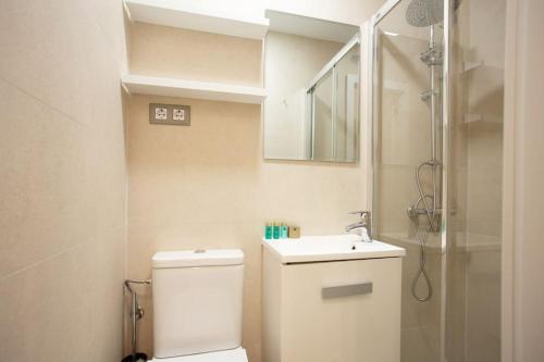 a bathroom with a toilet and a sink and a shower at Ideal flat in the Retiro area - C5 in Madrid