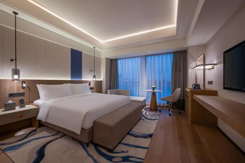 Katil atau katil-katil dalam bilik di Novotel Shanghai JingAn