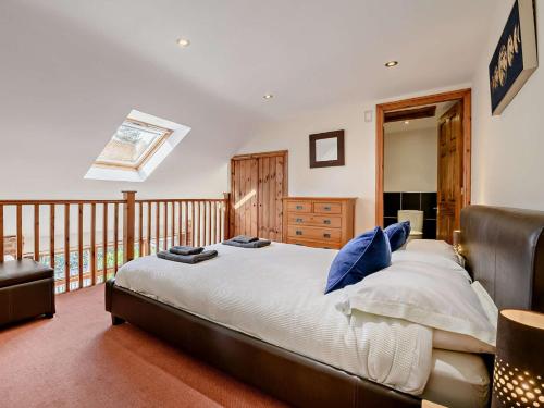 a bedroom with a large bed and a balcony at 1 Bed in Mattersey 91308 in Mattersey