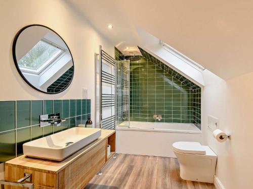 a bathroom with a sink and a toilet and a mirror at 2 Bed in Lauder 91383 in Lauder