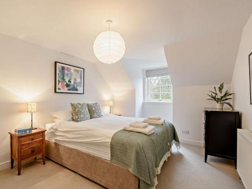 a bedroom with a large bed and a pendant light at 2 Bed in Lauder 91383 in Lauder