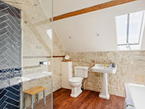 a bathroom with a toilet and a sink and a shower at 4 Bed in Melbury Abbas 91456 in Melbury Abbas