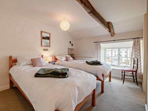 En eller flere senge i et værelse på 2 Bed in Middleham 91639