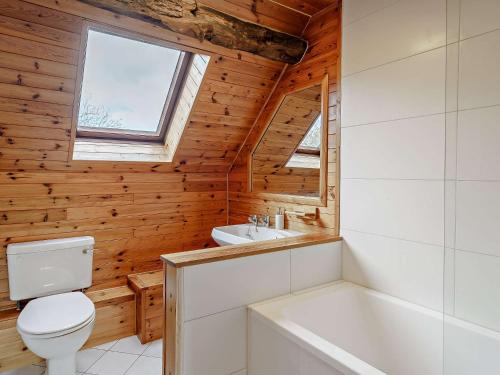 a bathroom with a toilet and a sink and a tub at 3 Bed in Caldwell 91578 in Caldwell