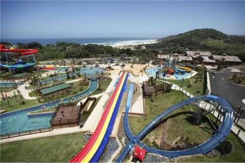 an amusement park with a roller coaster and a water park at Ocean View Villas - F6 in Port Edward