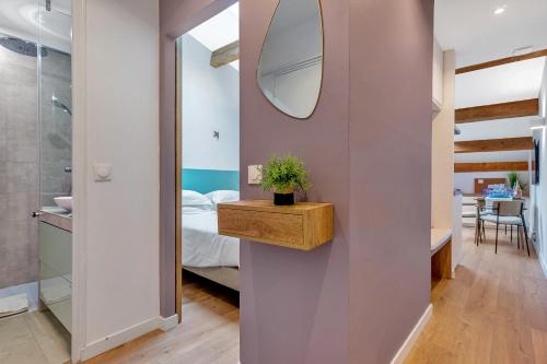 Letto o letti in una camera di Les Nids de la Diane - Appart'Conforts