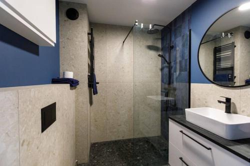 a bathroom with a sink and a mirror at GA Wroclaw&Jana Pawla- Free Parking in Wrocław