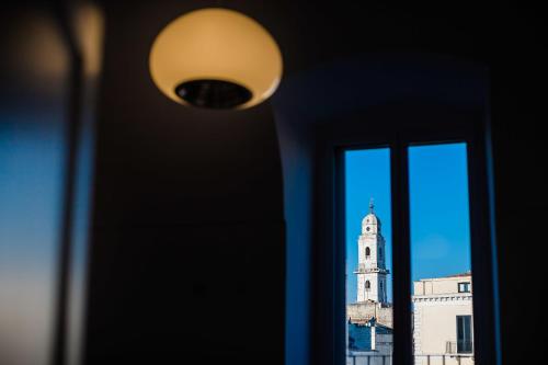 a view of a clock tower from a window at B&B Casa Ninè in Gioia del Colle