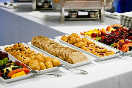 a buffet with several trays of food on a table at SpaHotel in Yerevan