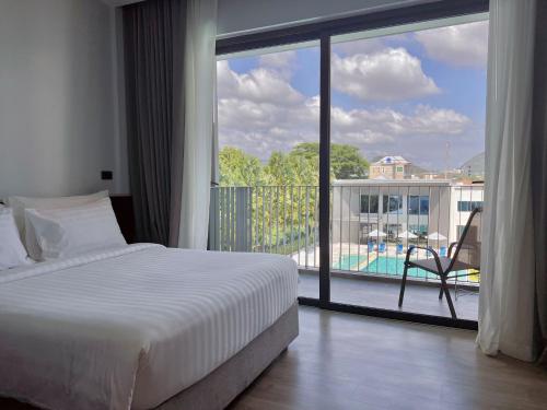 Postel nebo postele na pokoji v ubytování Seabed Grand Hotel Phuket - SHA Extra Plus