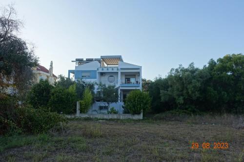 a house sitting on top of a field at Armonia Studios Preveza in Preveza