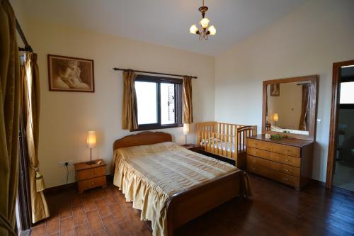 Postel nebo postele na pokoji v ubytování Kalli Villa