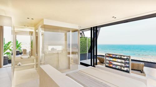 a living room with a view of the ocean at Victoria Palace Hotel in Cattolica