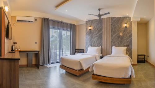 Ένα ή περισσότερα κρεβάτια σε δωμάτιο στο Extreme Dive Center & Hotel Rooms