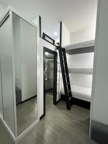 a room with a mirror and a bunk bed at Cotrades 2 San Blas-canillejas in Madrid