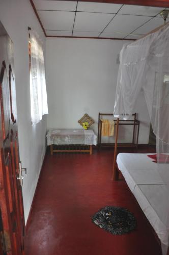 Ένα ή περισσότερα κρεβάτια σε δωμάτιο στο Sea Breeze Inn Talalla