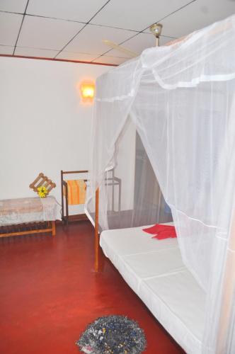 Ένα ή περισσότερα κρεβάτια σε δωμάτιο στο Sea Breeze Inn Talalla
