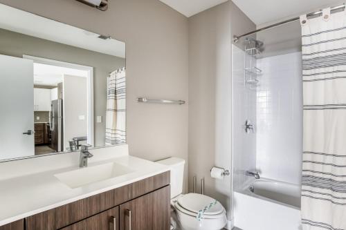 a bathroom with a sink and a toilet and a shower at North Station 2br w wd gym nr TD Garden BOS-327A in Boston