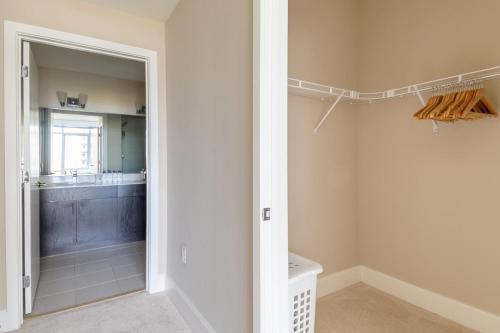 a bathroom with a walk in shower next to a toilet at Reston 2br steps to mall hospital restaurants WDC-832 in Reston