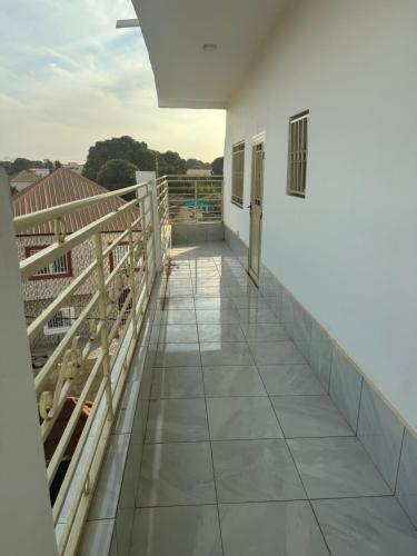 a view from the balcony of a house at H&M Penthouse in Serekunda