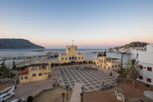 a view of the town of šibenik with the ocean in at Atlantis Hotel in Karpathos Town