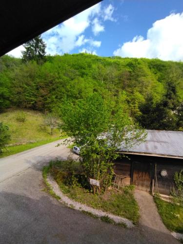 a view of a road next to a building at NOMAD ALP B&B in Marthod
