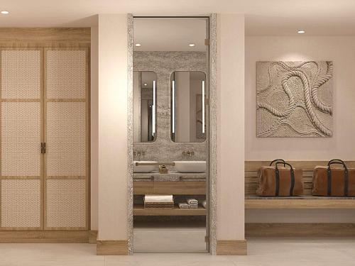 a bathroom with two sinks and a mirror at Hyde Bodrum - Adult Only in Bodrum City