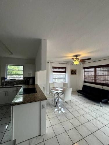 a kitchen with a table and a dining room at Beautiful Home in Florida in Hollywood