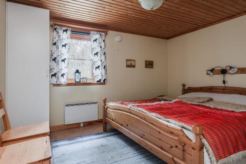 a bedroom with a bed and a window at Rödluvan in Mora