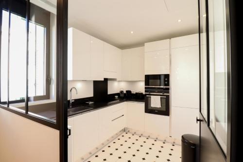 Kuchyň nebo kuchyňský kout v ubytování Residence Buttura
