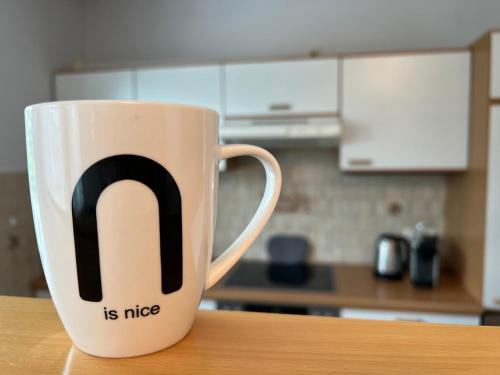 a coffee cup with the letter n on it at Der Landsitz in Klagenfurt