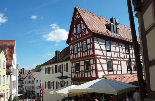 a building in a city with a market in front of it at Ferienhaus Robinson Romantikpfad 162 in Waldbrunn