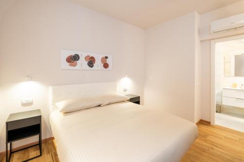 Postel nebo postele na pokoji v ubytování Palmanova Suites