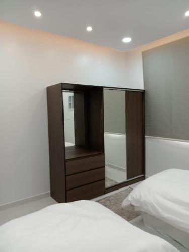 Una cama o camas en una habitación de شقق جادة قباء