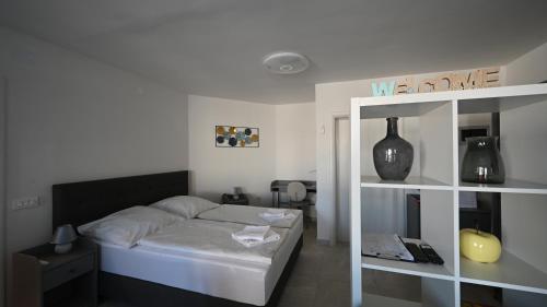 Postel nebo postele na pokoji v ubytování Casa Mira Apartments