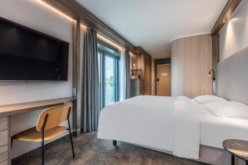 Ένα ή περισσότερα κρεβάτια σε δωμάτιο στο Park Inn By Radisson Wismar