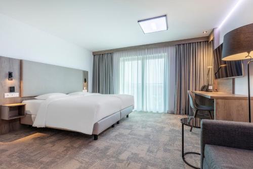 Ένα ή περισσότερα κρεβάτια σε δωμάτιο στο Park Inn By Radisson Wismar
