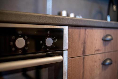 a kitchen counter with a stove top oven at City Loft 3 (Stamatina's Luxury Apartments) in Alexandroupoli