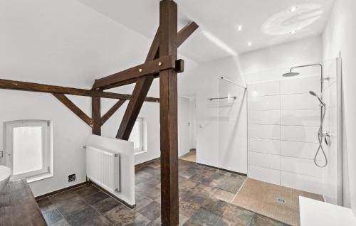 a white bathroom with a shower and a sink at Ferienwohnung Matilda in Loxstedt