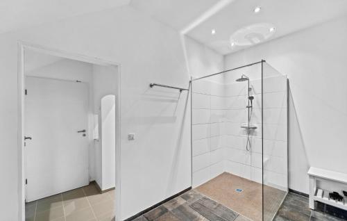 a glass shower stall in a white bathroom at Ferienwohnung Matilda in Loxstedt