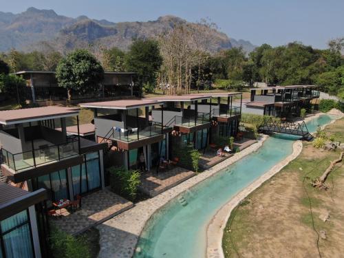an aerial view of a resort with a swimming pool at Kwai Tara Riverside Villas in Sai Yok